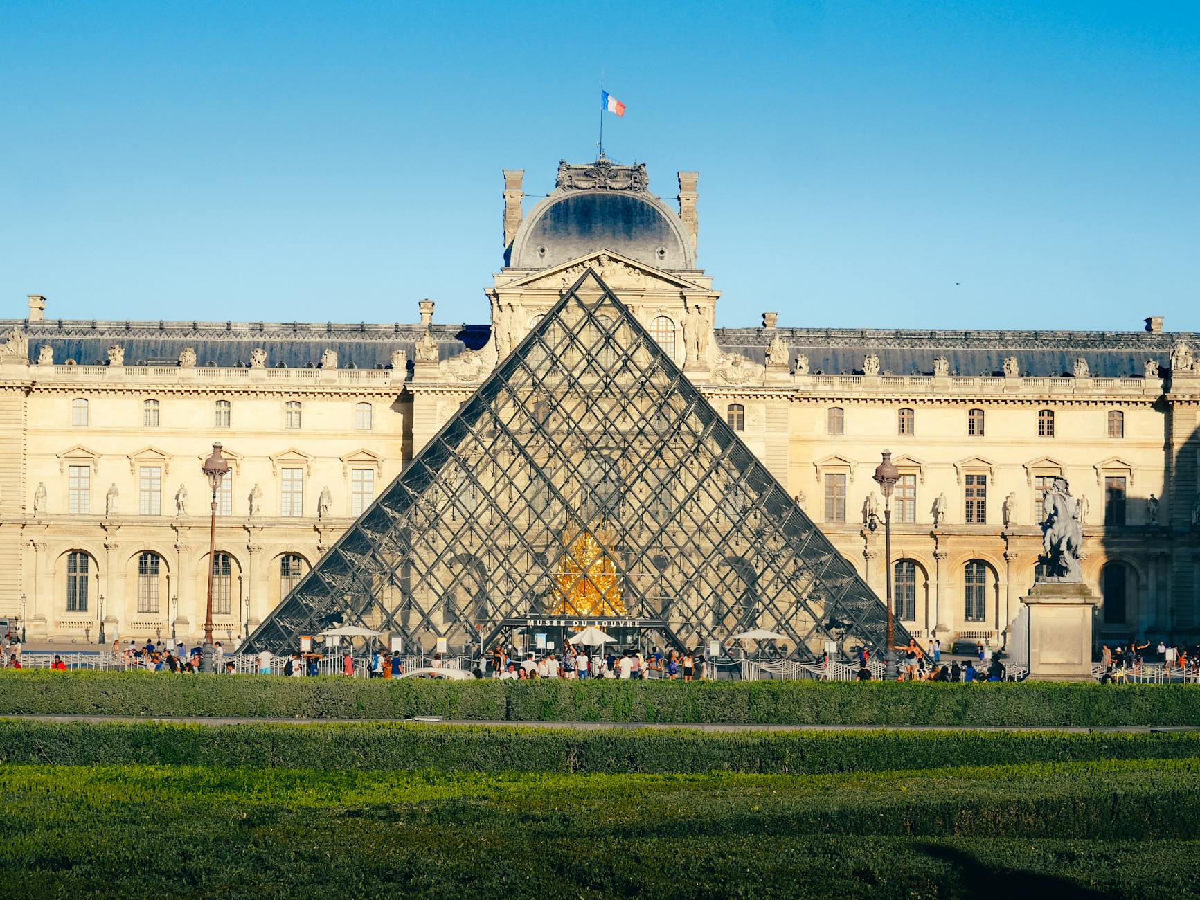 The Louvre Museum and Glass Pyramid in Paris, a world-famous cultural landmark and tourist destination.